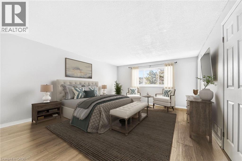 A bedroom with a large bed and a window with a view of trees.