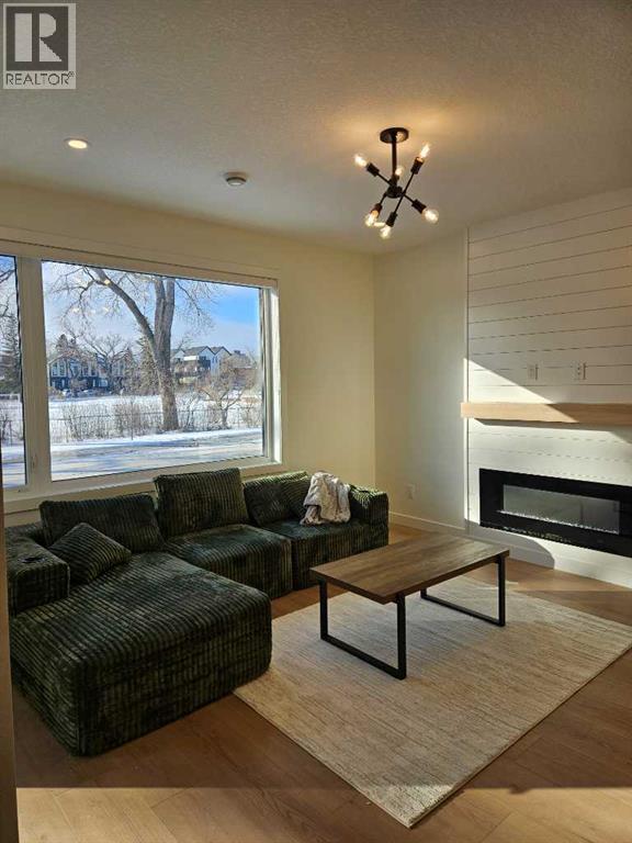 A living room with a fireplace and a couch.