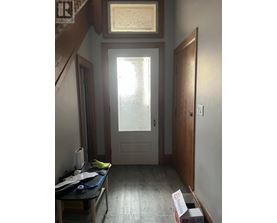 A room with a table and a box on the floor.