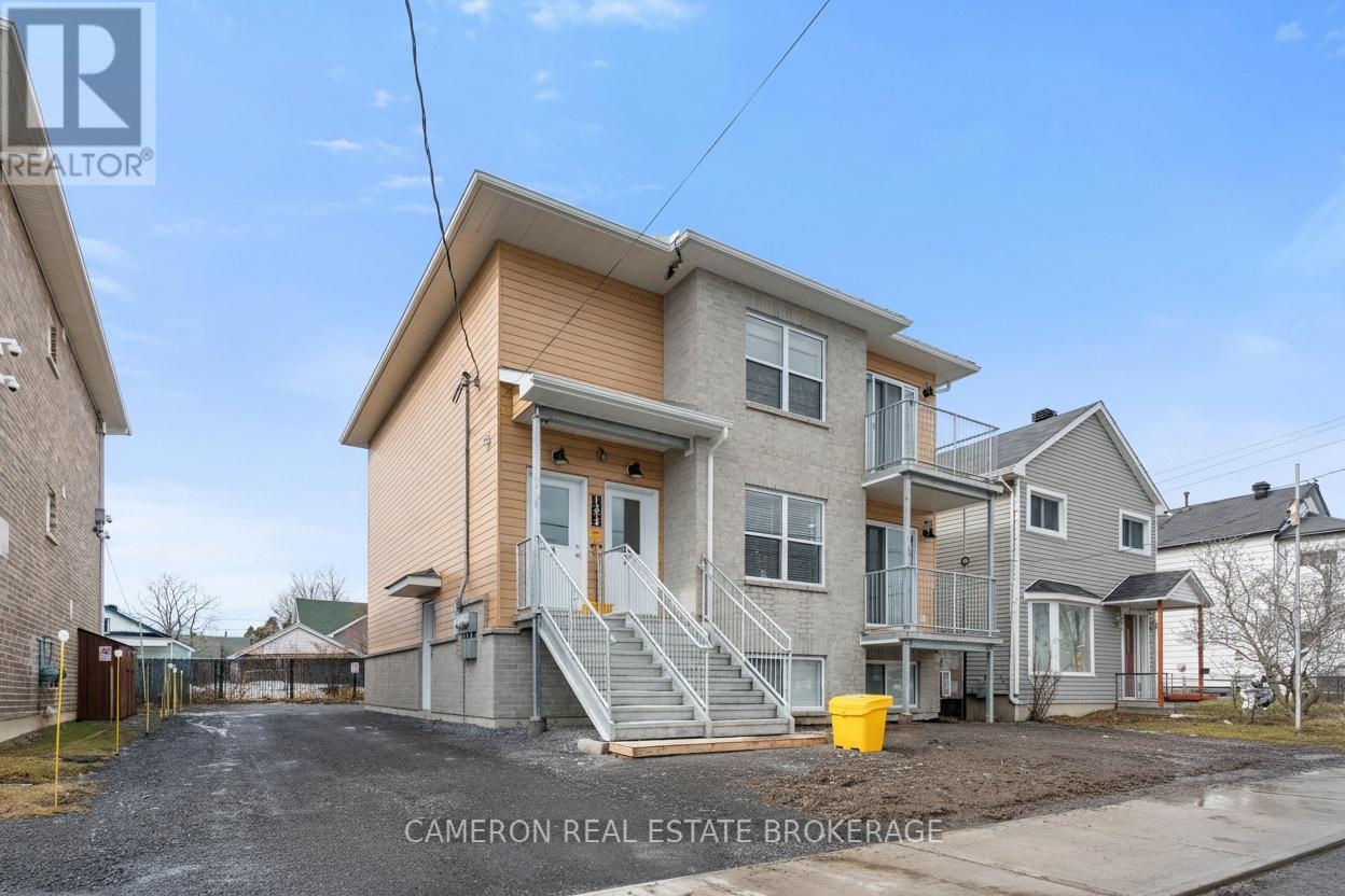 A two-story house with a garage is for sale.