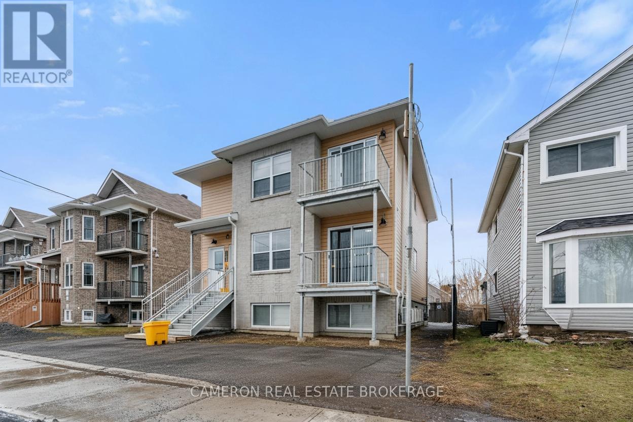 A row of houses with the middle one being the largest.