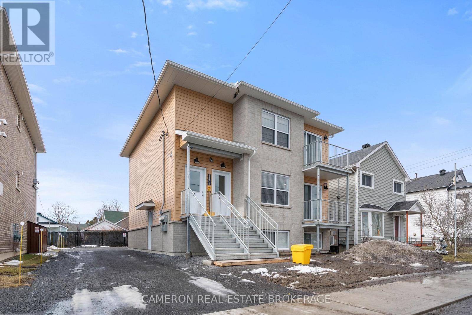 A two-story house with a garage is for sale.