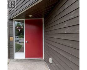 A red door with the number 7 on it.