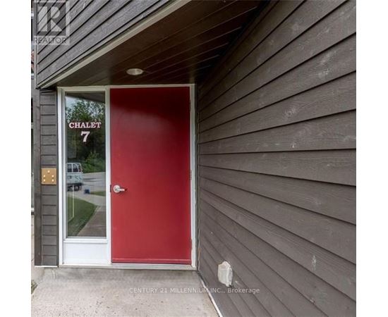 A red door with the number 7 on it.