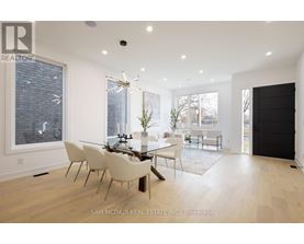 A dining room with a glass table and chairs.
