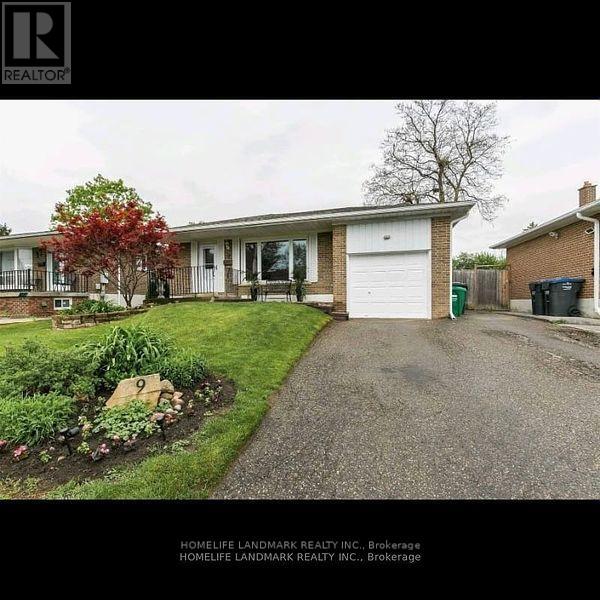 A real estate listing image of a home with a landscaped front yard.