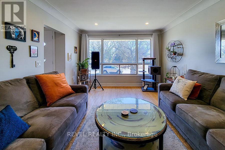 A living room with a glass coffee table and two couches.