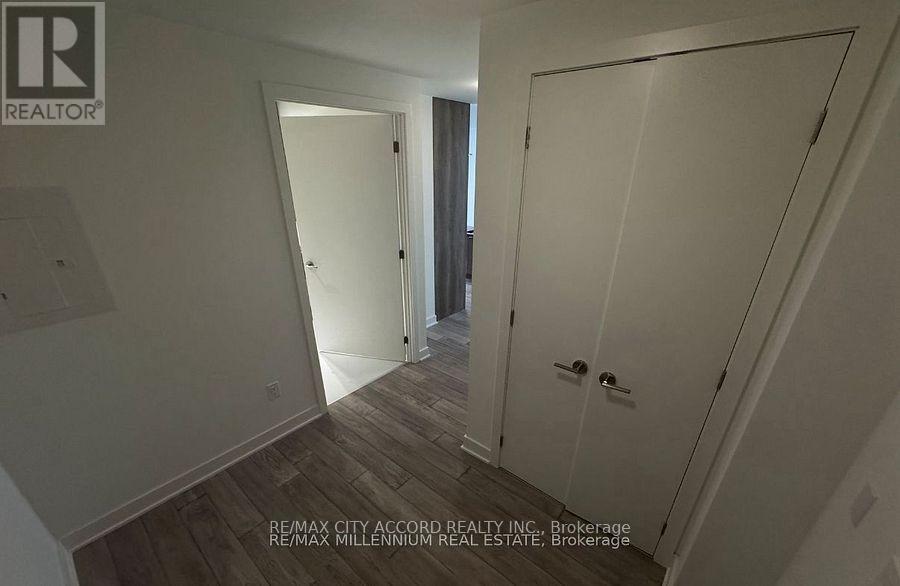 A hallway with a door on the right and a door on the left.