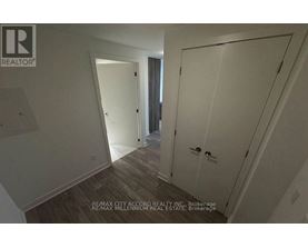 A hallway with a door on the right and a door on the left.