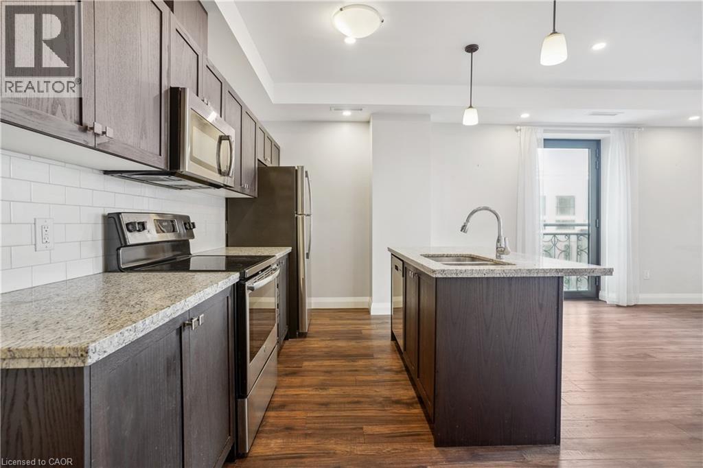 A kitchen with wooden cabinets and granite countertops.