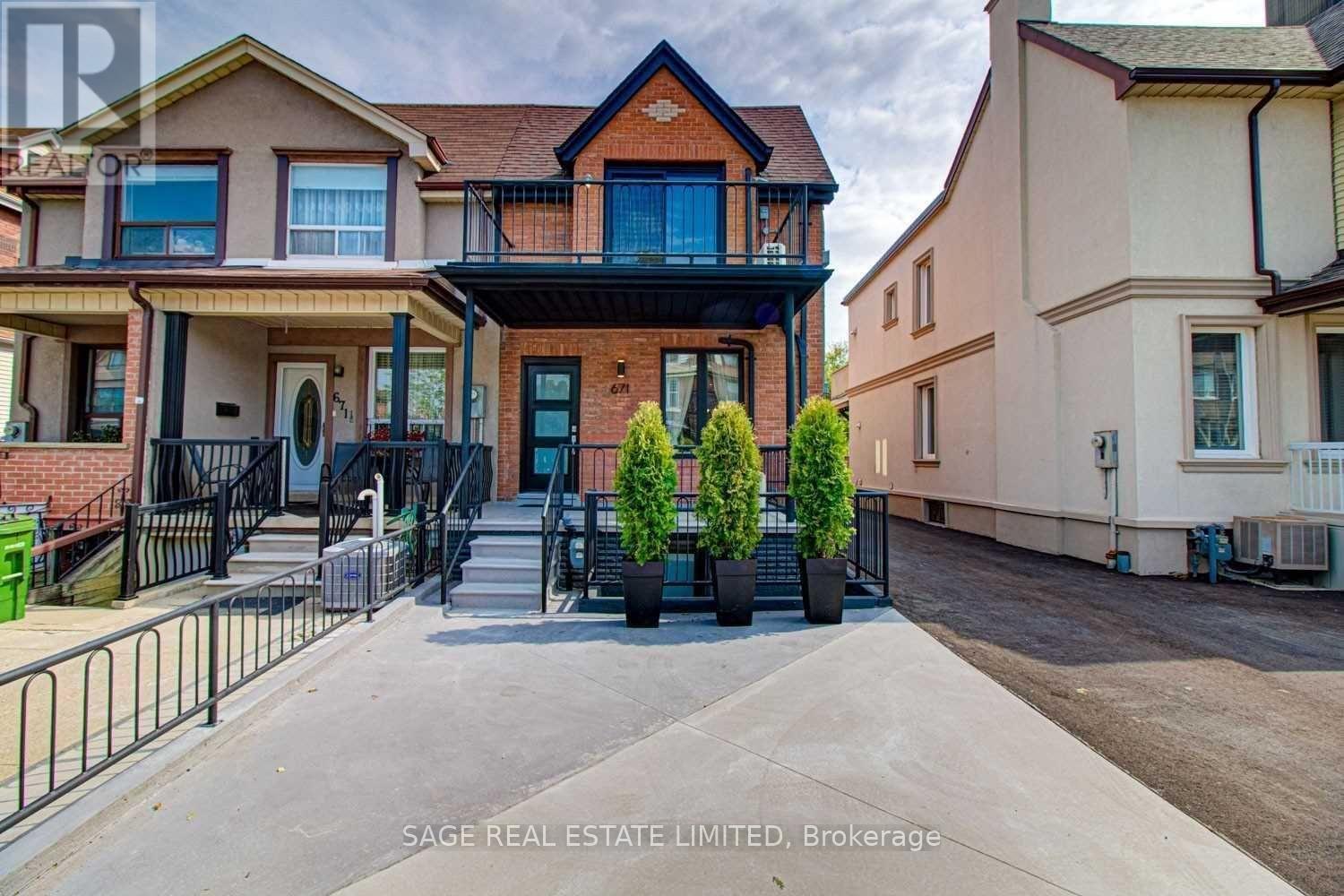 A real estate listing photo shows a two-story house with a balcony and a driveway.