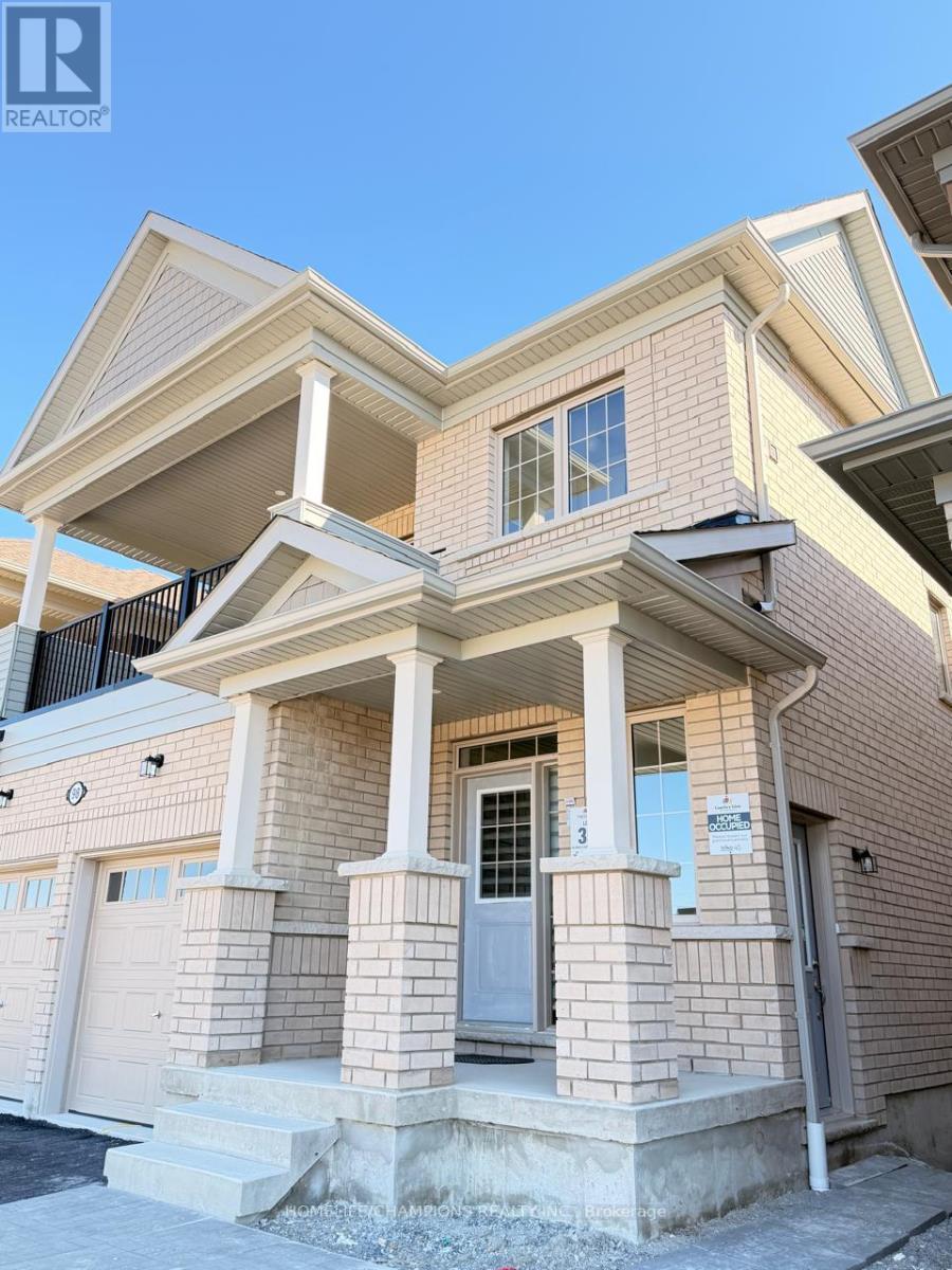A house with a brown brick facade and a white door.