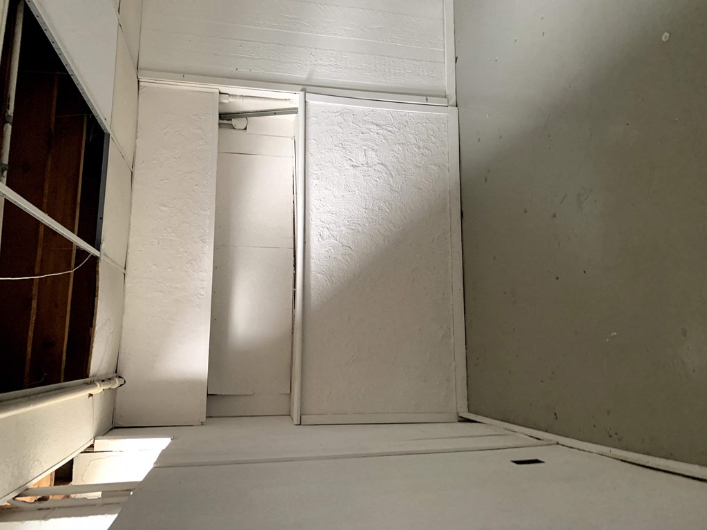 the closet in the master bathroom is primed and ready to be painted