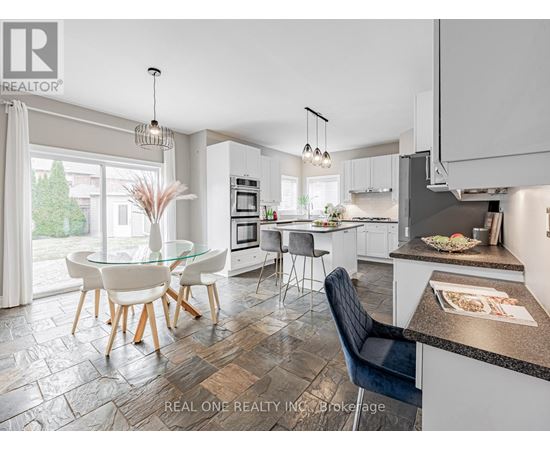 A modern kitchen with a glass table and chairs.