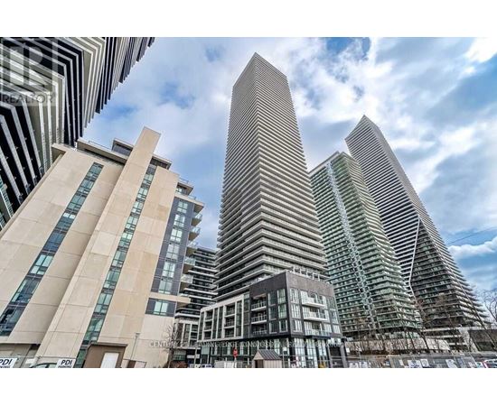 A modern cityscape with tall buildings and a clear sky.