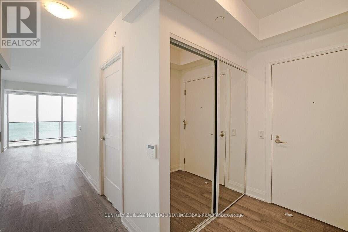 A realtor photo of a bedroom with a sliding door.