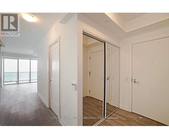 A realtor photo of a bedroom with a sliding door.
