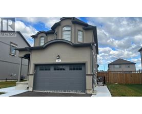 A modern house with a garage is for sale.