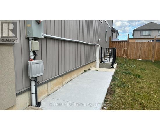 A grey building with a sign that says REALTOR on it.