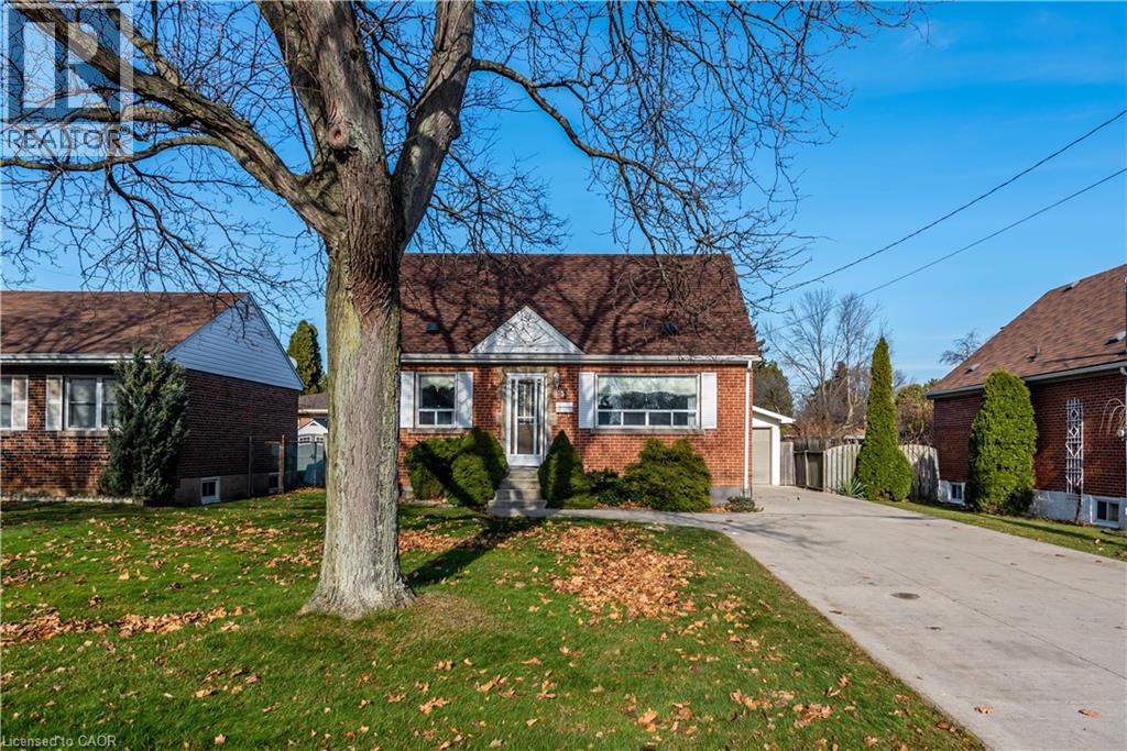 A house with a tree in front of it.