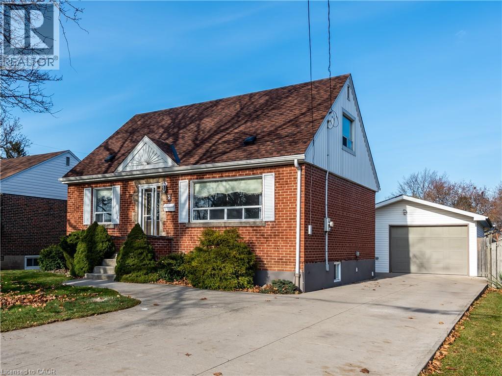 A two-story house with a garage is for sale.