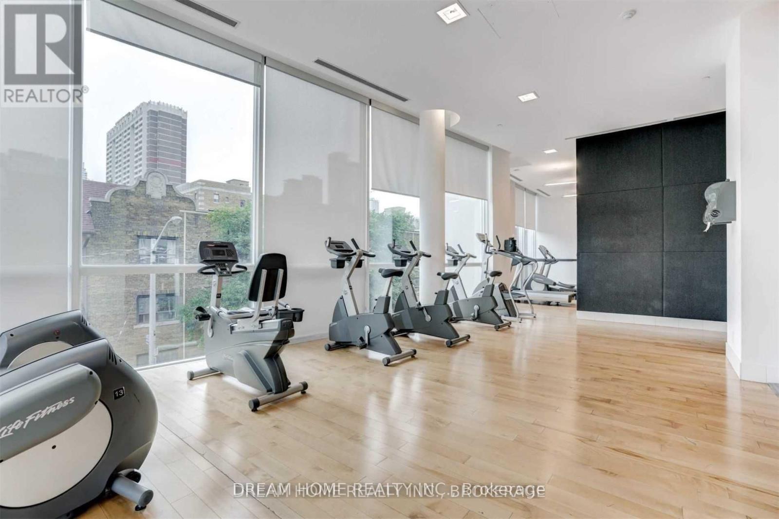 A gym with a view of the city skyline.
