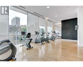 A gym with a view of the city skyline.