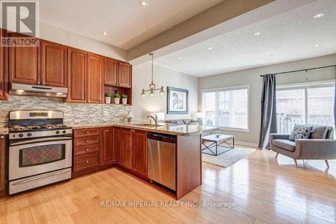 A modern kitchen with wooden cabinets and a stainless steel dishwasher.
