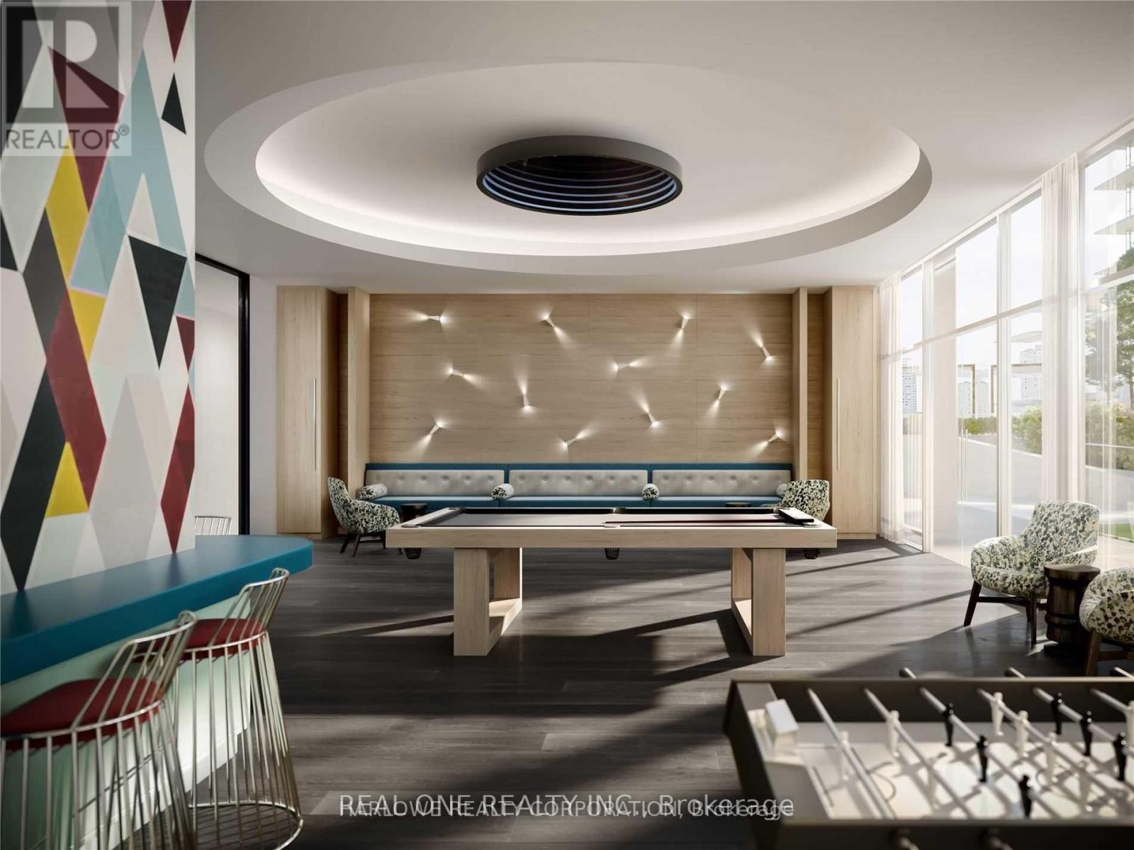 A modern living room with a pool table and a large window.