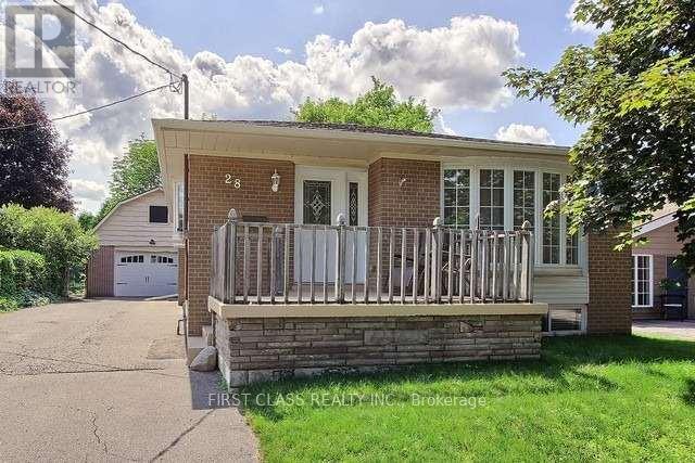 A small house with a porch and a garage.