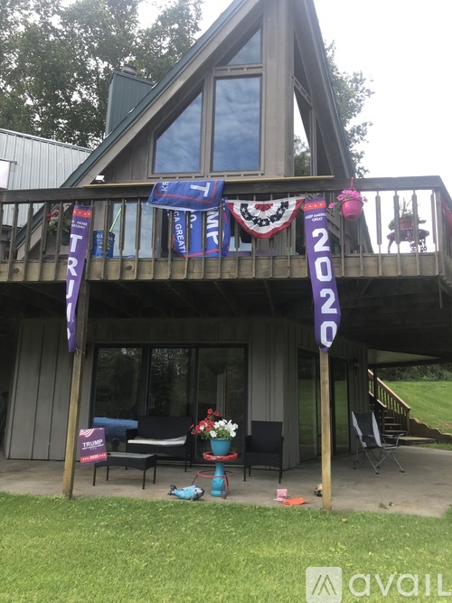 A house with a balcony and a sign that says "2020" on it.