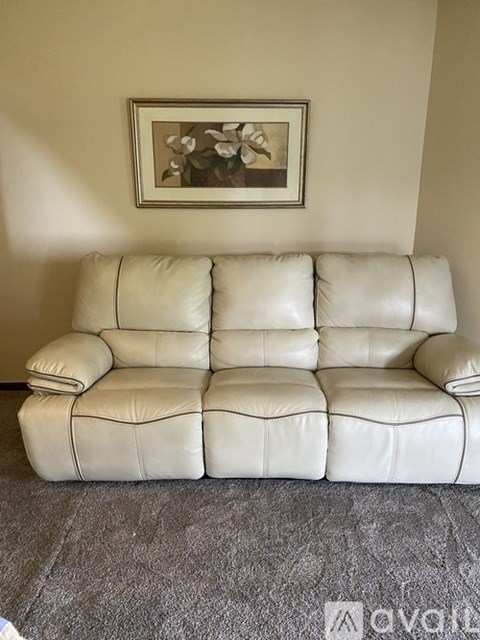 A white leather sofa in a living room.