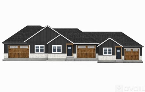 A black house with four garages and two windows on the ground floor.