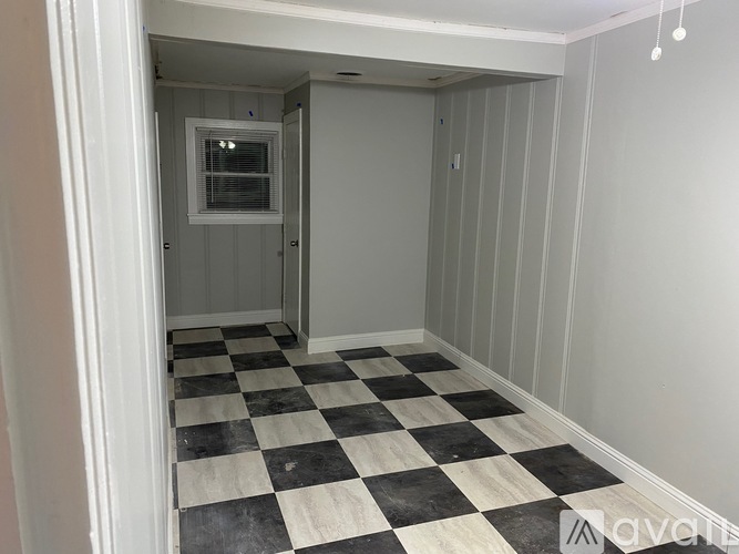 A room with a black and white checkered floor.