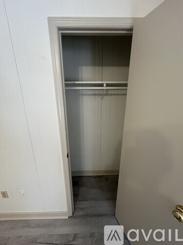 A white door with a glass window and a handle.