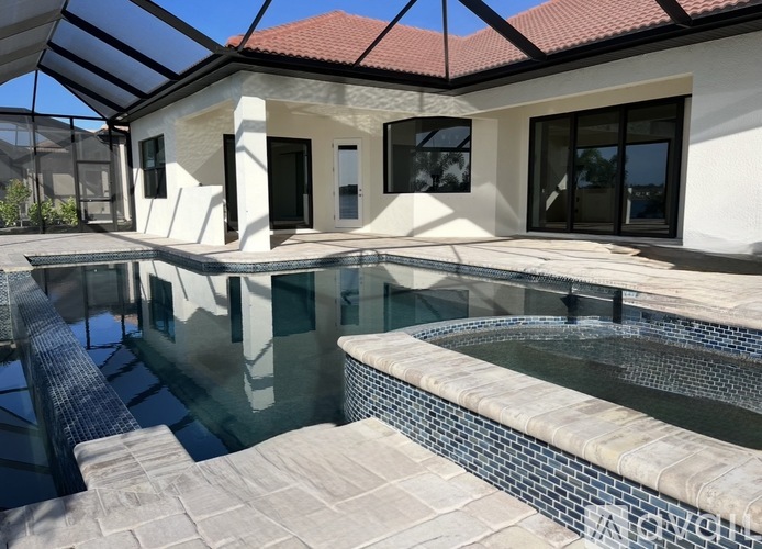 A modern house with a pool in the backyard.