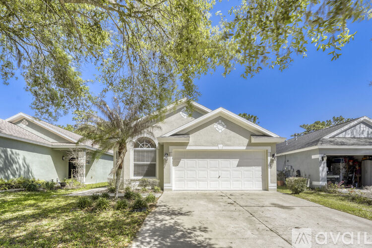 A house with a white garage door is for sale.
