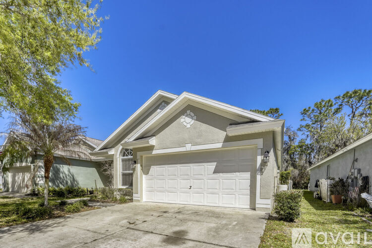A house with a white garage door is for sale.