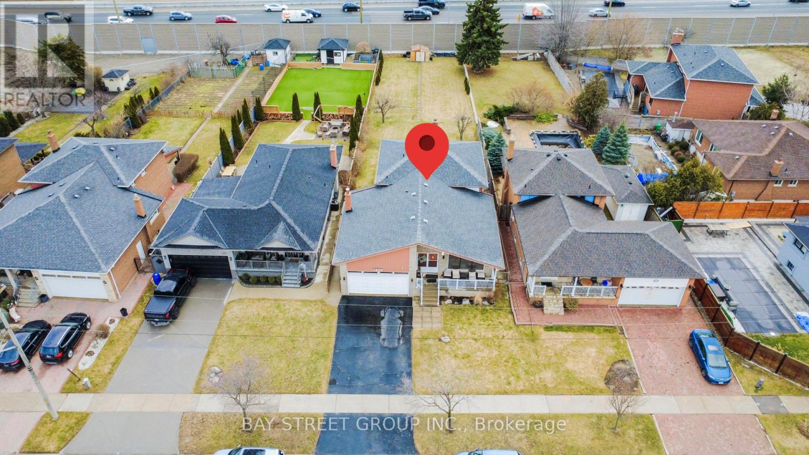 An aerial view of a residential area with Bay Street Group Inc. Brokerage written on the image.