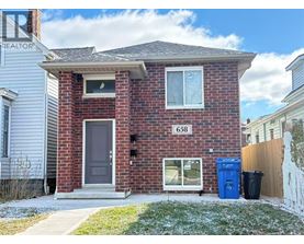 A red brick house with the number 658 on it.