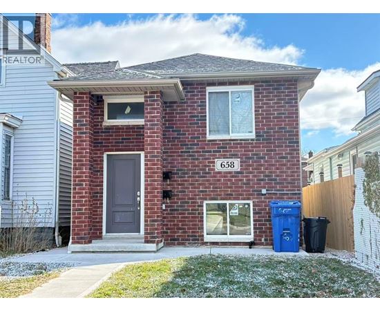 A red brick house with the number 658 on it.