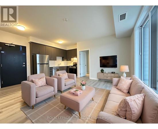 A living room with a grey sofa and a grey armchair.