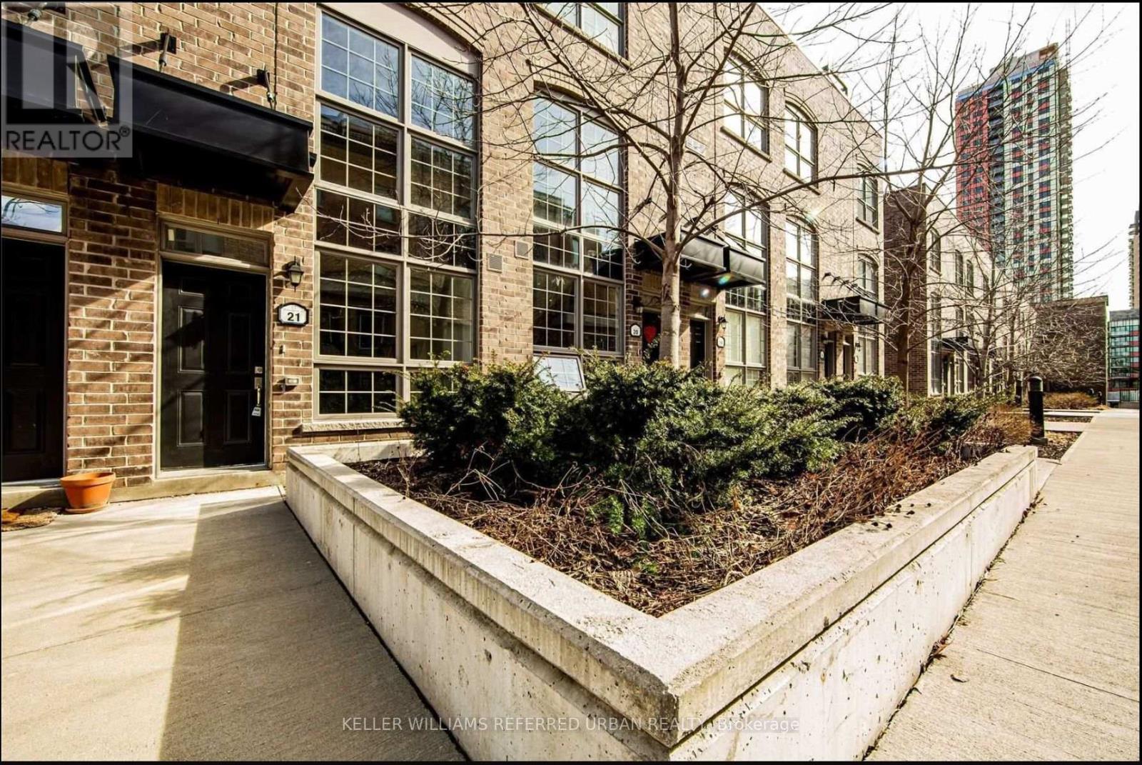 A building with a sign that says REALTOR in front of it.