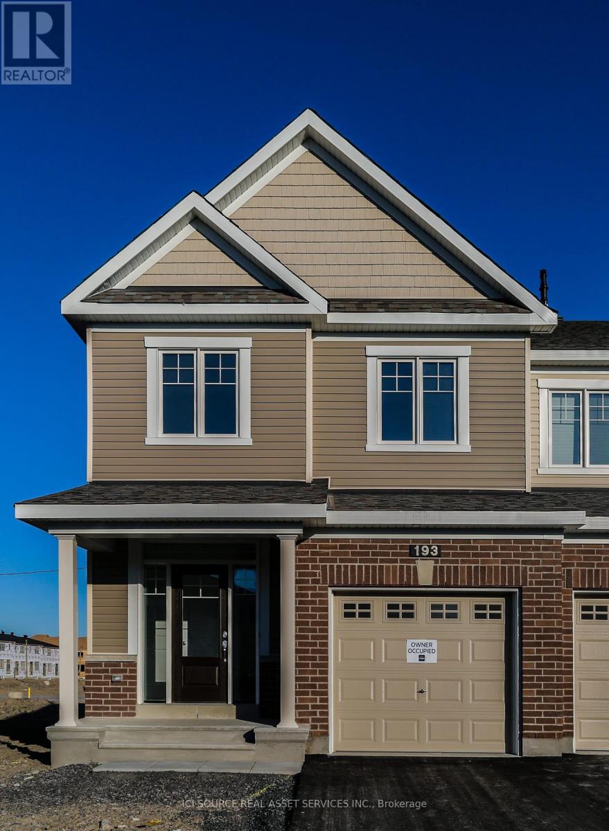 A two-story house with a garage is numbered 193.