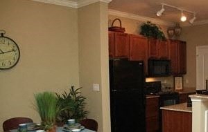 a kitchen and dining room with a table and chairs