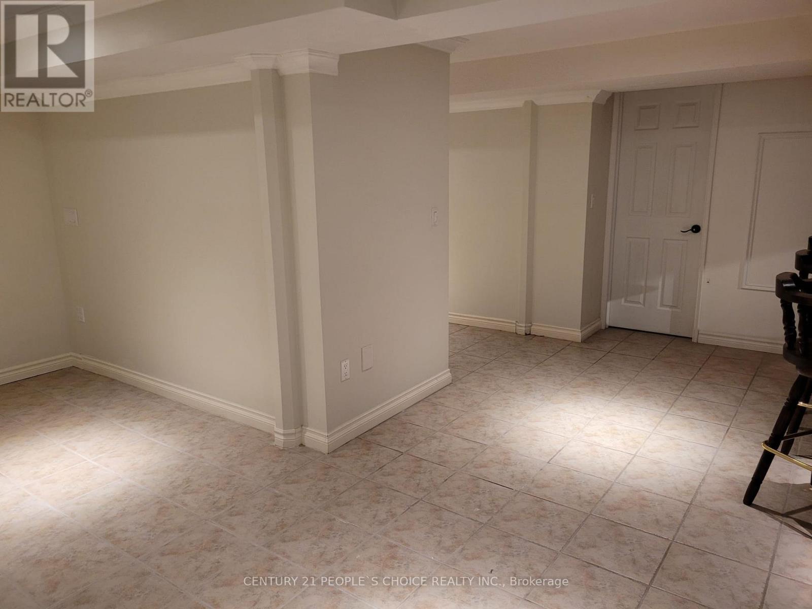 A room with white walls and a tiled floor.
