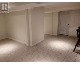 A room with white walls and a tiled floor.