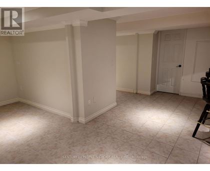 A room with white walls and a tiled floor.