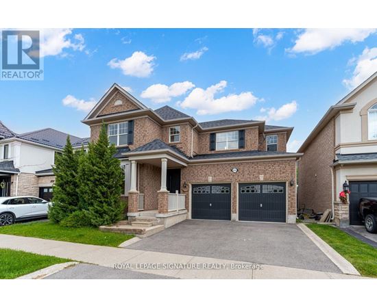 A large, two-story house with a garage is for sale in Brockville.
