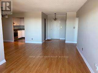 A room with wooden floors and white walls.